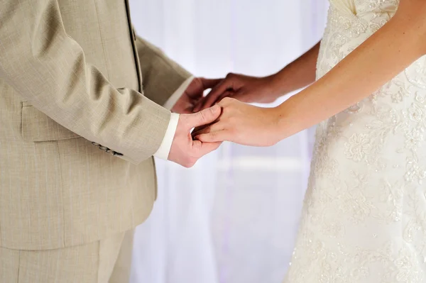 Bride and groom holding his hands — Stock Photo, Image