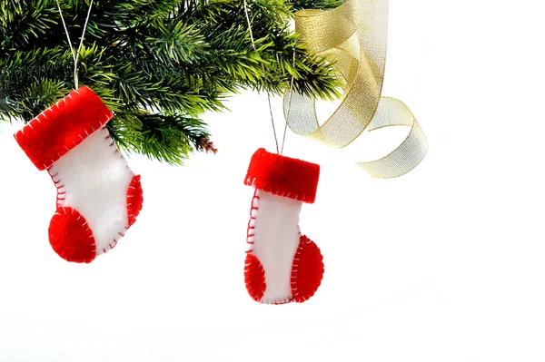 Santa's boots on christmas tree — Stock Photo, Image