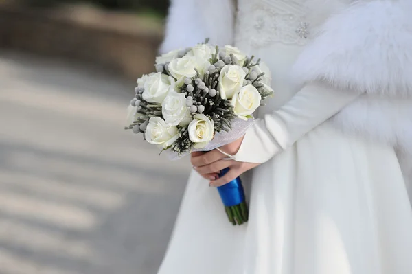 Bride holding white wedding bouquet — Stock Photo, Image