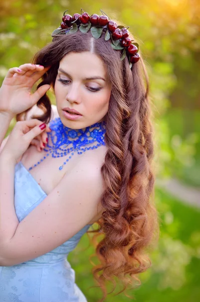 Beautiful girl on a background of green grass — Stock Photo, Image