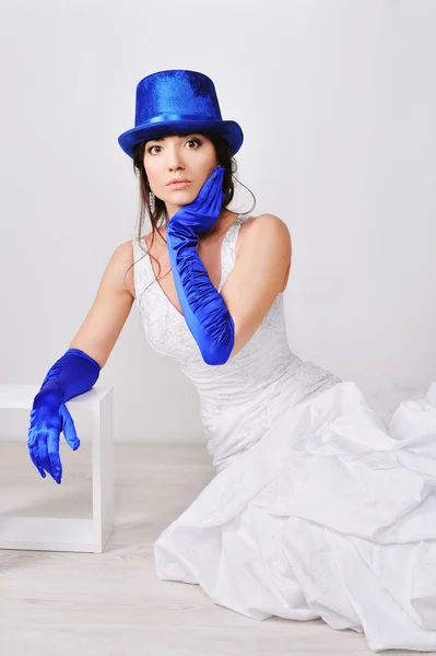 Frightened, surprised the bride in blue gloves and hat — Stock Photo, Image