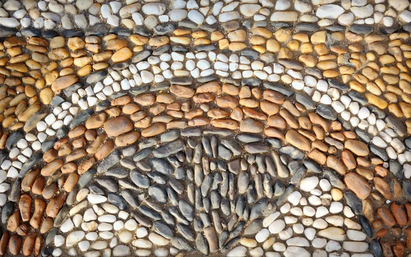 Belo ornamento de pedras no chão — Fotografia de Stock