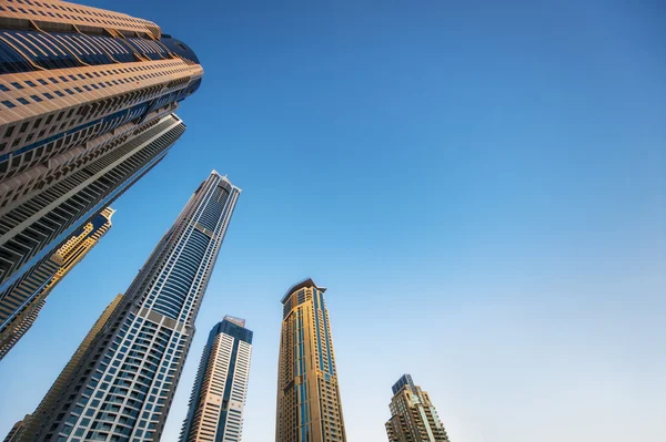 High beautiful skyscrapers on blue sky background — Stock Photo, Image