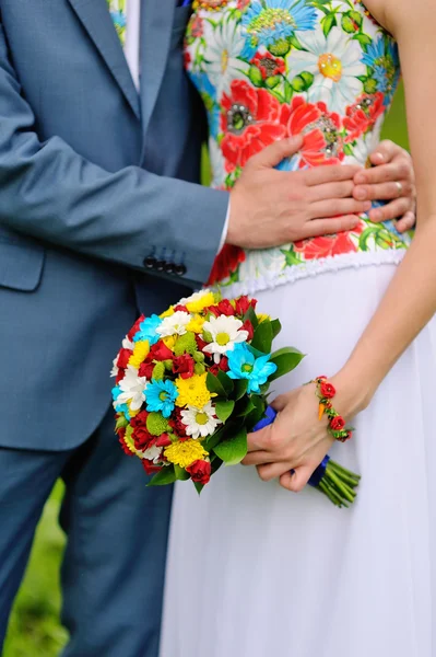Colorful wedding bouquet in hands of the bride — Stock Photo, Image