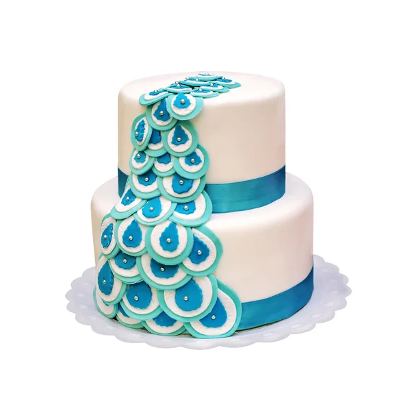 Beautiful two-tiered cake with turquoise ribbons. isolated — Stock Photo, Image