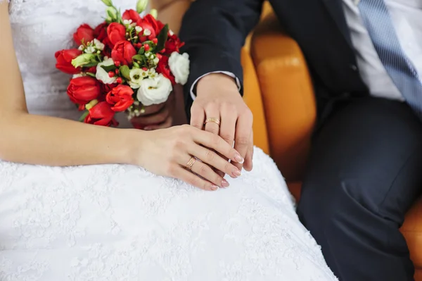 Hands with rings bride and groom Stock Picture