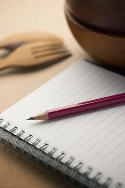 Pencil laying on the notebook — Stock Photo, Image