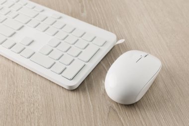 The white computer keyboard is in white packaging.