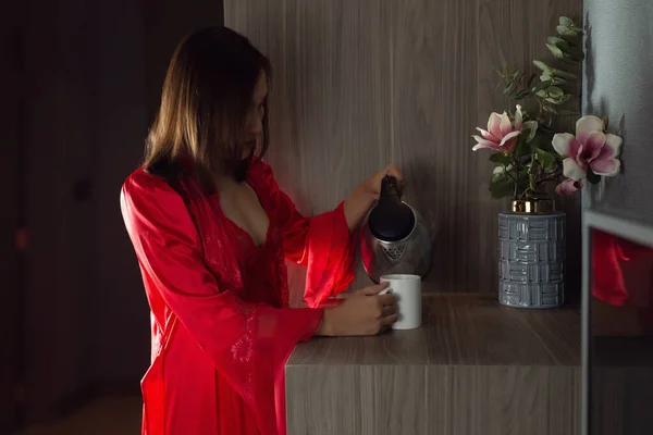 Asian Woman Red Satin Nightgown Lace Robe Pouring Hot Water — Stock Fotó