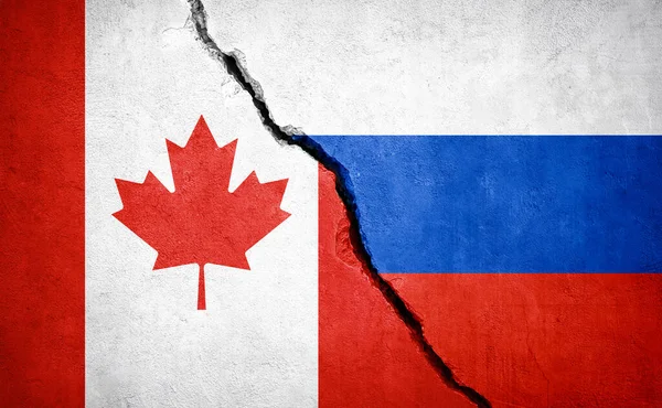 加拿大和俄罗斯的冲突 破墙上的国旗 说明1 — 图库照片
