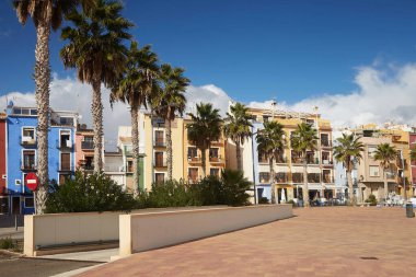Colorful houses and palms on the Costa Blanca in the old fishing town of Villajoyosa, Spain.