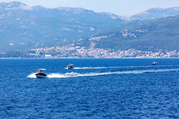 Boat tour on the water bay . Speeding boats on the Kotor Bay in Herceg Novi Montenegro