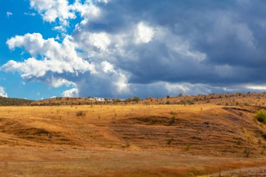 Low clouds over the hill . Autumn rolling hills scenery 