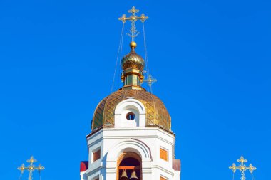 Golden dome with cross on the top . Church Bell tower 
