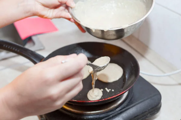 Cooking pancakes in a pan . Homemade pancakes