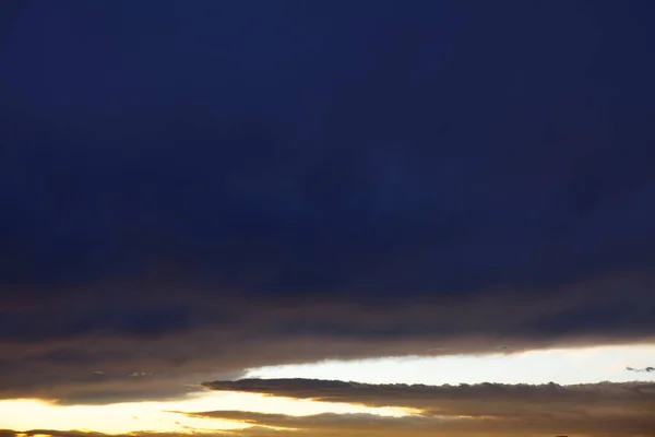 Darkness on the sky . Black clouds and stormy weather