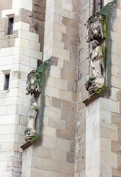 Gothic sculptures on the exterior wall of the cathedral . Old statues of saints