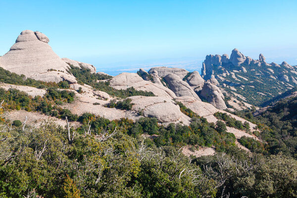 Clusters of towering rock in a mountain landscape . Natural park of Montserrat Catalonia Spain