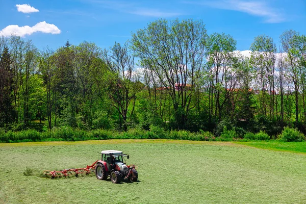 Tractor on agricultural land . Agricultural machine on springtime field