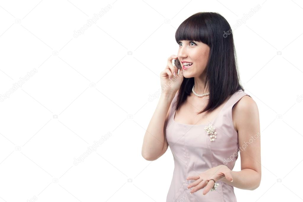 A beautiful businesswoman who speaks emotionally on the phone