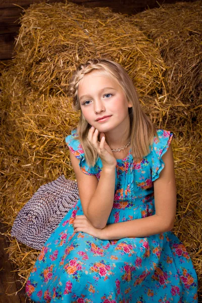 Cute girl w hayloft — Zdjęcie stockowe