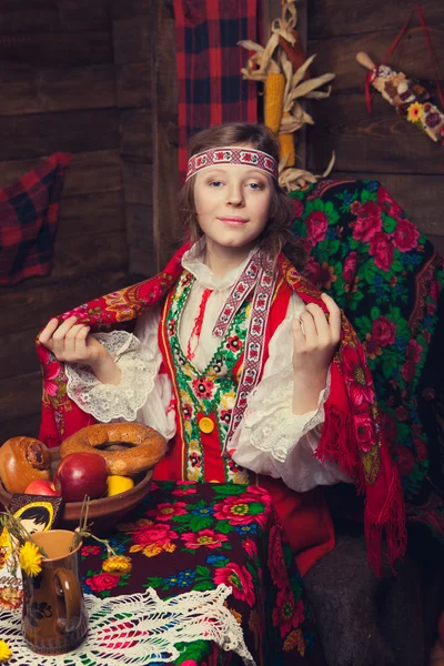 Russian beauty in a wooden interior — Stock Photo, Image