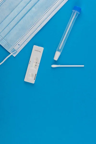 Express antigen test for coronavirus covid 19 self-check at home. Laboratory card corona rapid test device. Negative result. Set with medical swab nose sticks, tube and mask