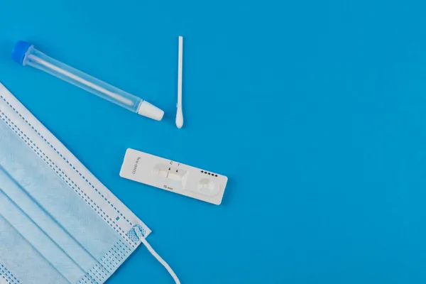 Express antigen test for coronavirus covid 19 self-check at home. Laboratory card corona rapid test device. Negative result. Set with medical swab nose sticks, tube and mask