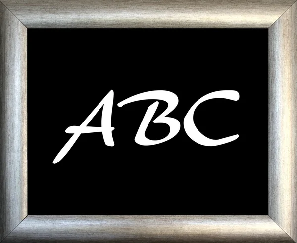 Abc und silberner Bilderrahmen auf schwarzem Hintergrund — Stockfoto