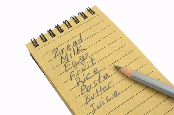 Pencil and handwriting shopping list — Stock Photo, Image