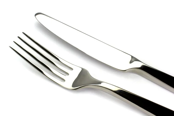 Forchetta e coltello su sfondo bianco — Foto Stock