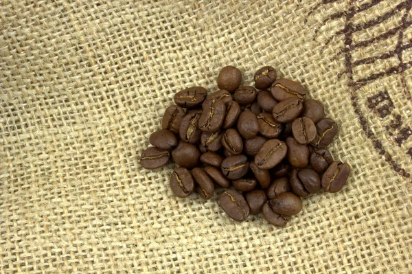 Coffee beans on flax bag — Stock Photo, Image