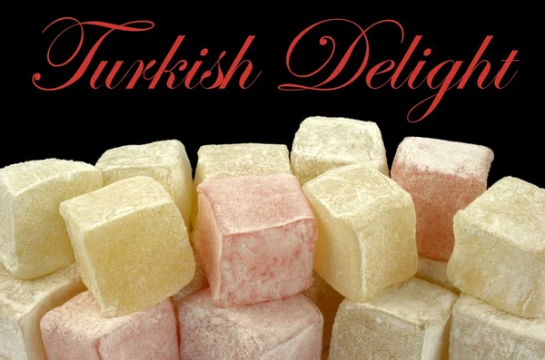 土耳其软糖和黑色背景上的示例文本 — 图库照片