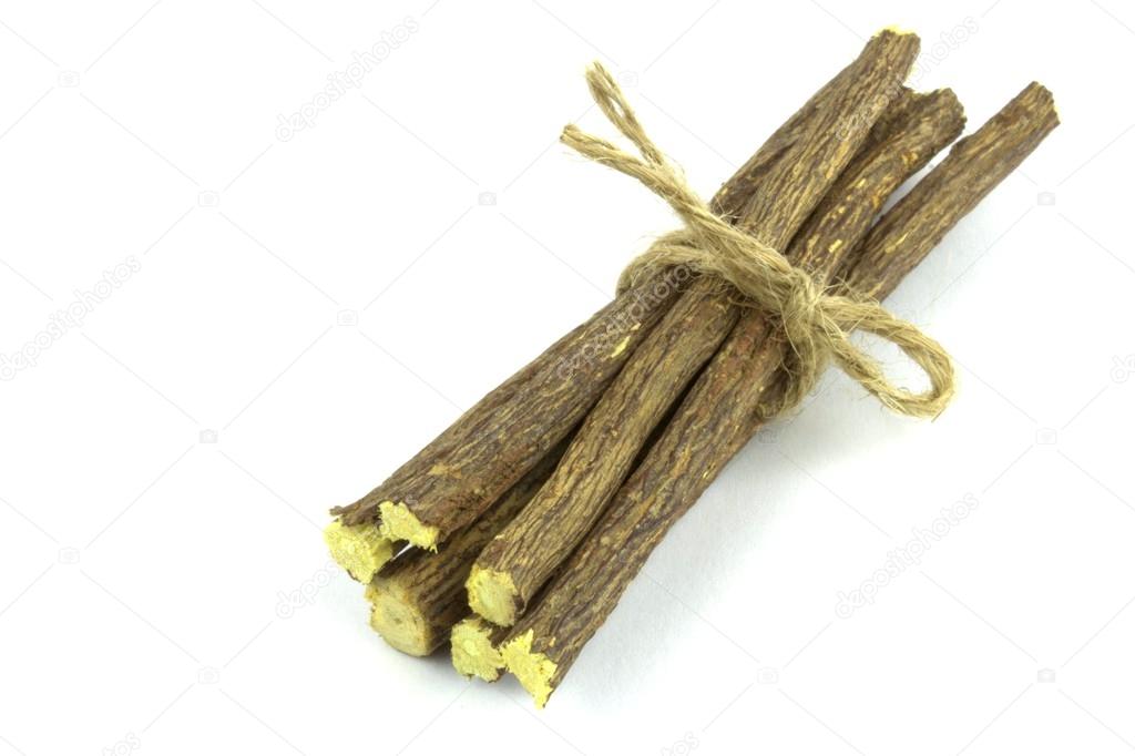 Licorice roots on white background