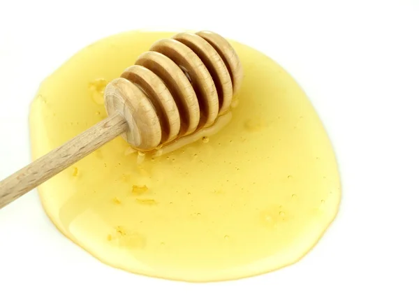 Miel et cuillère à miel en bois — Photo