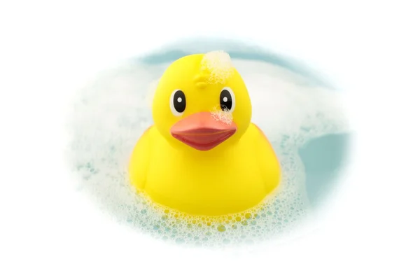 Bath time and rubber duck in soap foam — Stock Photo, Image