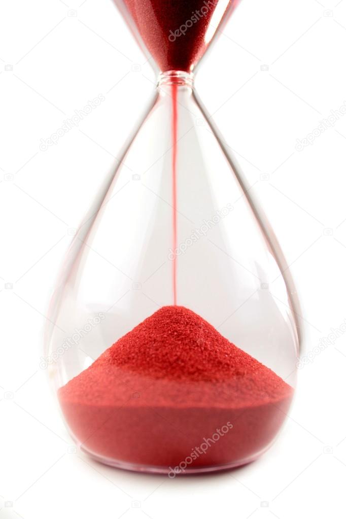 Hourglass with red sand on white background