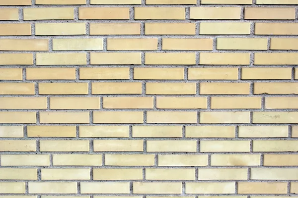Žlutá cihlová zeď — Stock fotografie