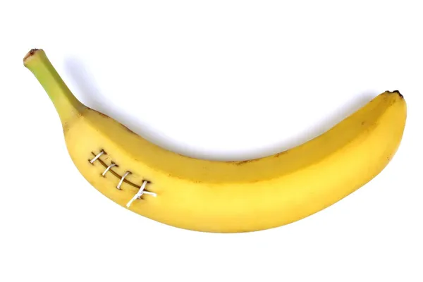 Injured banana stitched up — Stock Photo, Image