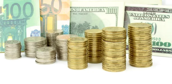 Moedas, notas de euro e de dólar — Fotografia de Stock