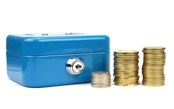 Cash box with lock and stacked coins — Stock Photo, Image