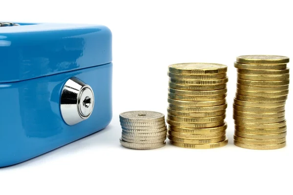 Cash box and stacked coins — Stock Photo, Image