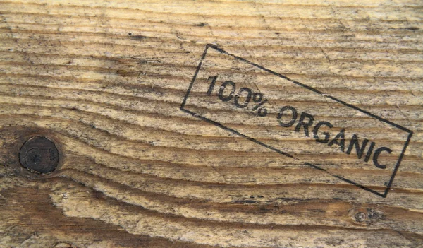 Vieille texture bois avec texte de timbre organique — Photo