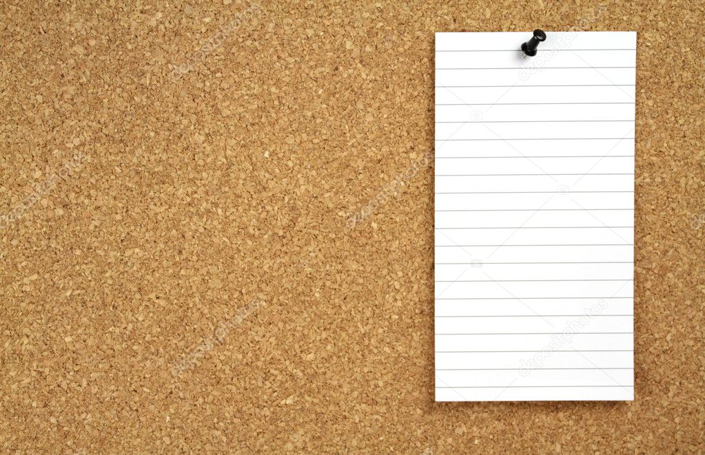 Cork board and white note paper
