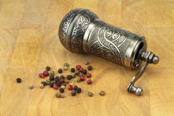 Pepper grinder and mixed peppers — Stock Photo, Image