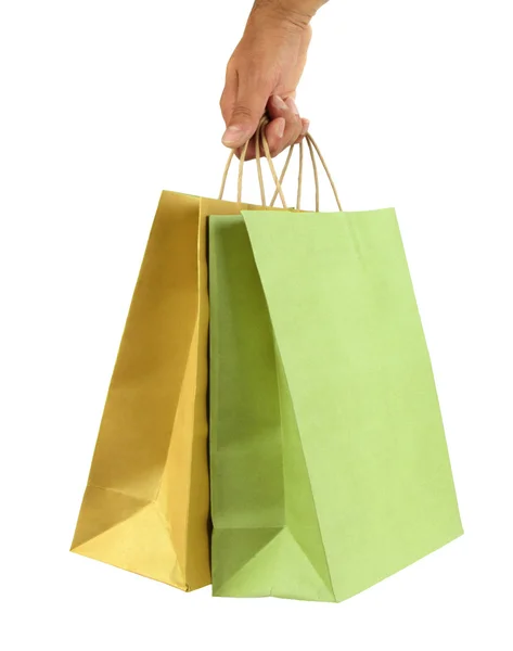Ręką człowieka niesie ze sobą torby na zakupy — Zdjęcie stockowe