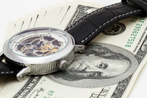 100 dollars on white background with wristwatches — Stock Photo, Image