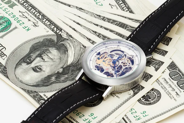 100 dólares sobre fondo blanco con relojes de pulsera —  Fotos de Stock