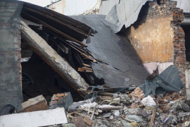 ruins of a building with brick walls and a collapsed roof