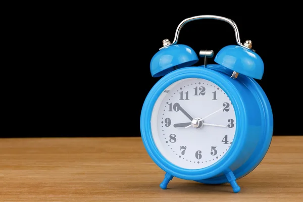 Alarm clock watch on wood — Stock Photo, Image